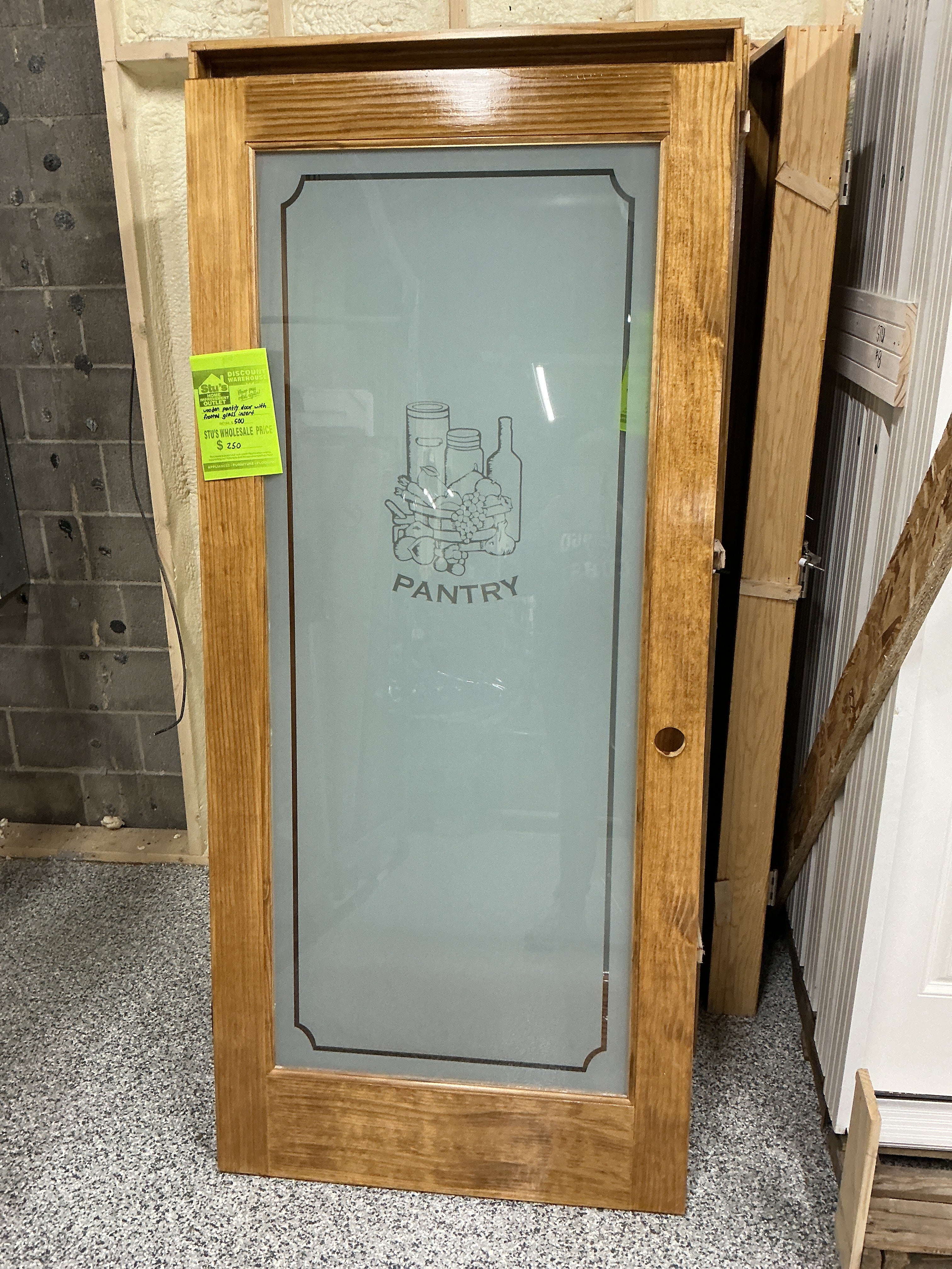 Wooden pantry door with frosted glass insert