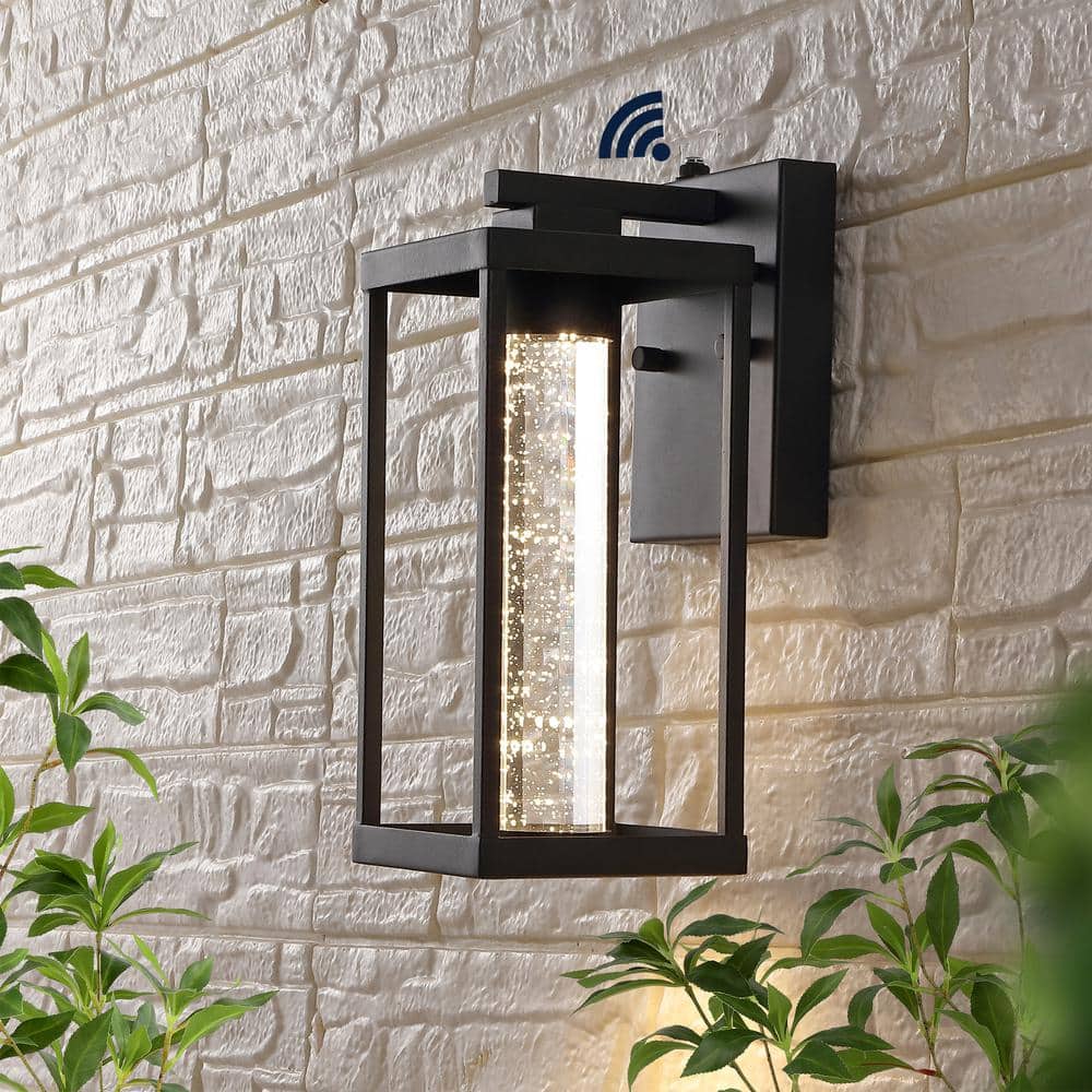 Juno 4.75 in. Black Hardwired Outdoor Cylinder Sconce Iron/Seeded Glass with Dusk - to - Dawn Sensor Integrated LED 1 - Light - Stu's Home Improvement Outlet