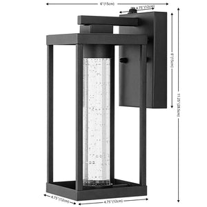 Juno 4.75 in. Black Hardwired Outdoor Cylinder Sconce Iron/Seeded Glass with Dusk - to - Dawn Sensor Integrated LED 1 - Light - Stu's Home Improvement Outlet