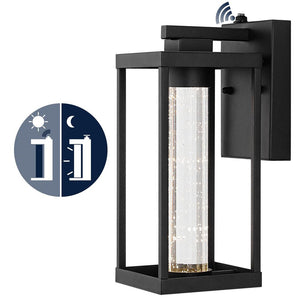 Juno 4.75 in. Black Hardwired Outdoor Cylinder Sconce Iron/Seeded Glass with Dusk - to - Dawn Sensor Integrated LED 1 - Light - Stu's Home Improvement Outlet