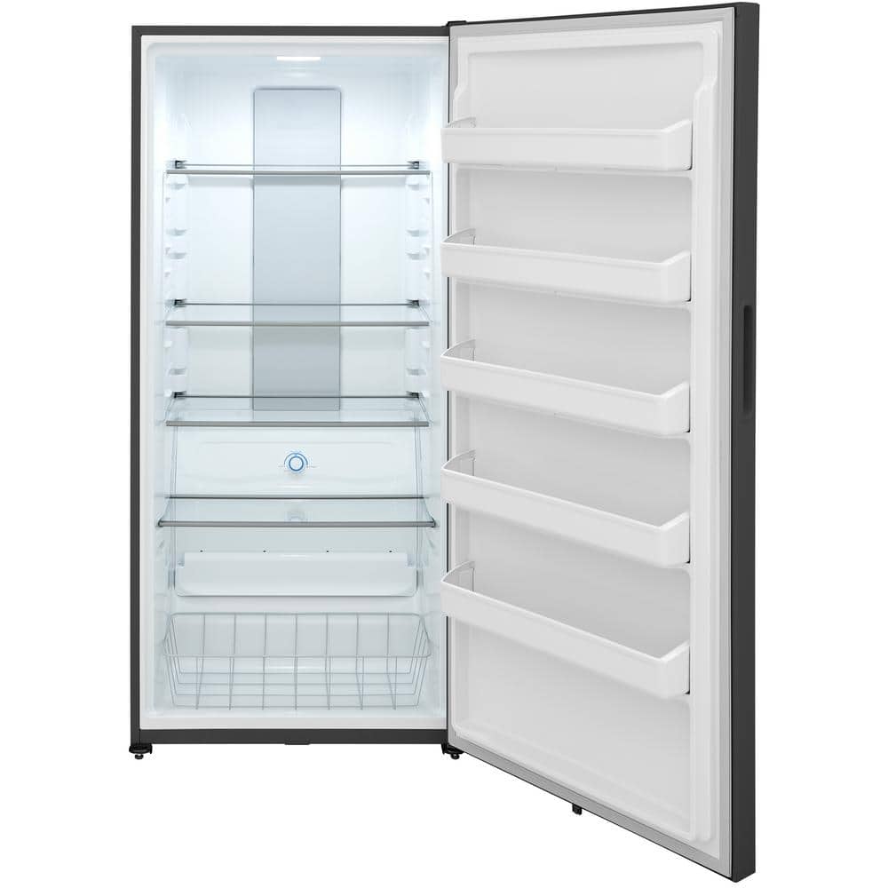 Open refrigerator with shelves, storage bins, and a light, empty except for a few items.