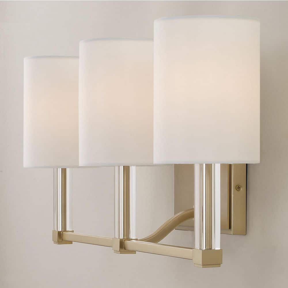 Ingrid 24 in. W x 9.75 in. H 3 - Light Matte Brass Vanity Light with Clear Acrylic Accents and White Fabric Shades - Stu's Home Improvement Outlet